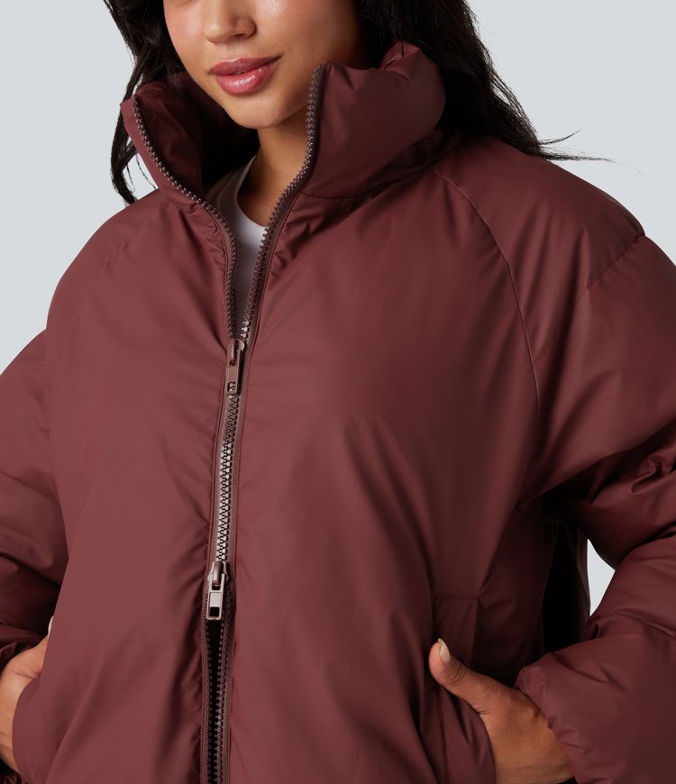 oversize-pufferjacke mit hohem kragen kordelzug am saum und taschen